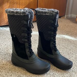 The North Face women’s tall black quilted suede winter snow boots